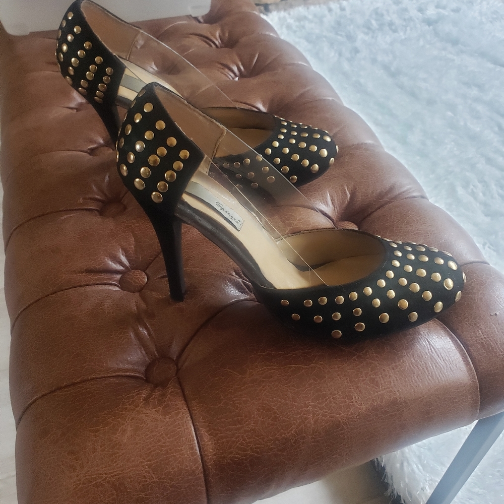 Black pumps with gold studs, clear side inserts